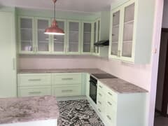 Kitchen with Granite Tops and Pistachio GreenÂ Doors and Panels