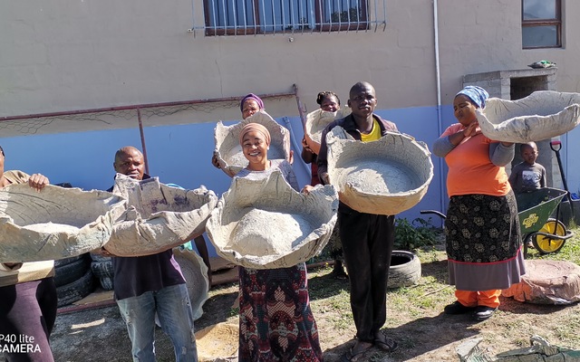 Practical workshop, students making cement pots for container planting.