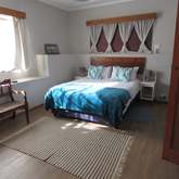 Main bedroom - Caledon Protea Cottage - Xplorioâ„¢ Caledon